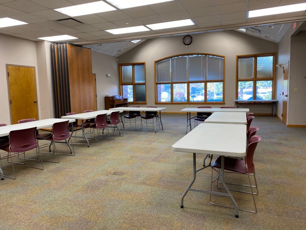 a picture of the large Salchow room with six long tables forming a U-shape with chairs around them